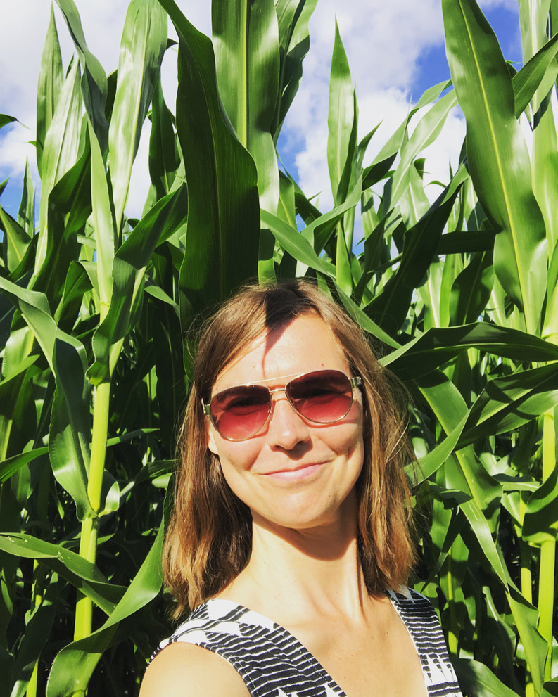 Portrait of Verena Spilker among corn plants